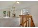Spacious living room featuring a fireplace, vaulted ceiling, and staircase to the second floor at 1972 S Carr St, Lakewood, CO 80227