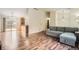 Open-concept living room with wood floors, vaulted ceiling, and neutral paint at 18981 E Mercer Dr, Aurora, CO 80013