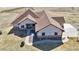 Aerial view of the residence showing the walkway to front door, a circular driveway and well maintained lawn at 620 Coyote Trl, Elizabeth, CO 80107