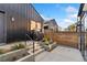 A cozy backyard with a grill and concrete stairs leading up to the house at 3709 Tejon St, Denver, CO 80211