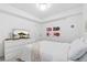 Cozy bedroom with modern dresser, television, and stylish decor accents at 3709 Tejon St, Denver, CO 80211