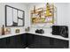 Finished bonus room features a stylish shelf and cabinets for storage and décor at 3709 Tejon St, Denver, CO 80211