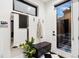 Bright entryway with a mirrored wall, coat rack, and stylish black-and-white tile flooring at 3709 Tejon St, Denver, CO 80211