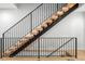Unique staircase with modern metal railings and wooden treads ascending to the next level at 3709 Tejon St, Denver, CO 80211