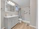 Nicely remodeled bathroom with a light vanity and tiled shower at 9501 W 89Th Cir, Broomfield, CO 80021