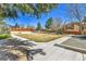 A well-maintained community park features a green space, playground, and walking paths for resident enjoyment at 9501 W 89Th Cir, Broomfield, CO 80021