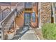 Inviting front entrance with a stone pathway and a cozy staircase, enhanced by neat landscaping at 9501 W 89Th Cir, Broomfield, CO 80021