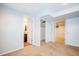 Spacious basement room with neutral carpet, with access to a full bathroom and storage at 2523 E Geddes Ave, Centennial, CO 80122