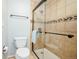 This bathroom features tile floors, a glass shower with tile surround, and a modern toilet at 2523 E Geddes Ave, Centennial, CO 80122