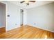 This bedroom features hardwood floors, neutral walls and closet with sliding doors at 2523 E Geddes Ave, Centennial, CO 80122