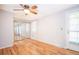 This spacious bedroom features wood floors, neutral walls and closet with mirrored sliding doors at 2523 E Geddes Ave, Centennial, CO 80122