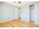 This bedroom features hardwood floors, neutral walls and closet with sliding doors at 2523 E Geddes Ave, Centennial, CO 80122