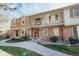 Charming brick townhouse with a balcony, well-maintained front yard and ample curb appeal at 2523 E Geddes Ave, Centennial, CO 80122