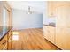 Modern kitchen seamlessly connects to the dining area with sleek countertop and classic wooden cabinets at 2523 E Geddes Ave, Centennial, CO 80122