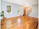 Bright living room with hardwood floors, fresh paint, and lots of natural light from the large windows at 2523 E Geddes Ave, Centennial, CO 80122
