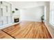 Spacious living room featuring hardwood floors, a cozy fireplace, and built-in bookshelves for display at 2523 E Geddes Ave, Centennial, CO 80122