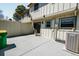 Spacious concrete patio features privacy fence, HVAC system, and sliding door access at 2523 E Geddes Ave, Centennial, CO 80122