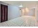 Spacious basement featuring tiled floors, neutral paint, and ample room for various activities at 5481 Xanadu St, Denver, CO 80239