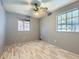 Bedroom featuring neutral walls, ceiling fan, and laminate wood floors at 5481 Xanadu St, Denver, CO 80239
