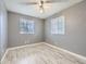 Bedroom featuring neutral walls, ceiling fan, and laminate wood floors at 5481 Xanadu St, Denver, CO 80239