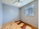 Bedroom with ceiling fan, window and wood floors at 5481 Xanadu St, Denver, CO 80239