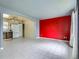 View of the combined living space leading into the kitchen with tile floors at 5481 Xanadu St, Denver, CO 80239