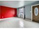 Open floor plan features living and dining areas with tiled flooring and neutral tones at 5481 Xanadu St, Denver, CO 80239