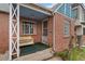 Inviting front porch with seating and classic architectural details at 1425 Xavier St, Denver, CO 80204