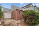 Back exterior showcasing the brick home and detached garage at 1425 Xavier St, Denver, CO 80204