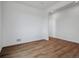 Open concept living area featuring hardwood floors, recessed lights and white walls at 45909 Wood Thrush Ave, Bennett, CO 80102