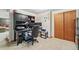 Basement office with a desk, chair and storage at 5107 Johnson St, Arvada, CO 80002