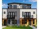 Modern townhome with mixed materials, multiple balconies, and contemporary design at 3510 Wyandot St, Denver, CO 80211
