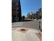 Street view with crosswalks and buildings on either side, under a clear blue sky at 3510 Wyandot St, Denver, CO 80211