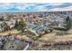 Aerial view of property showcasing the home's setting in a tree-lined neighborhood at 34 S Raleigh St, Denver, CO 80219
