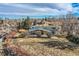 Aerial view of property showcasing mature trees, landscaping, and surrounding neighborhood at 34 S Raleigh St, Denver, CO 80219