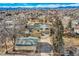 Aerial view of the home and detached garage, showcasing the large lot and surrounding neighborhood with mountain views at 34 S Raleigh St, Denver, CO 80219