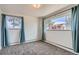 Neutral bedroom with gray carpeting, natural light, and calming curtains at 34 S Raleigh St, Denver, CO 80219