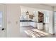 Updated kitchen featuring a modern island and white cabinets at 34 S Raleigh St, Denver, CO 80219