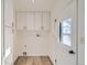 Clean, well-lit laundry room with ample cabinet space at 34 S Raleigh St, Denver, CO 80219