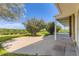 A concrete patio extends from home providing great view of expansive backyard and open sky at 34 S Raleigh St, Denver, CO 80219