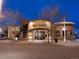 A nighttime view of the Bar Louie restaurant with outdoor lighting at 7110 W Alaska Dr # A, Lakewood, CO 80226