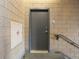 Hallway features a solid gray door with a combination lock and a fire department valve at 7110 W Alaska Dr # A, Lakewood, CO 80226