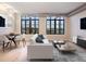 Modern living area with large windows, hardwood floors, and stylish decor at 7110 W Alaska Dr # A, Lakewood, CO 80226