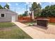 Enjoy outdoor living with a patio, bar-height table with umbrella, and well-maintained yard in this home at 1290 S Elizabeth St, Denver, CO 80210
