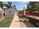 Private backyard with a patio, shed, and well-maintained lawn for outdoor enjoyment at 1290 S Elizabeth St, Denver, CO 80210