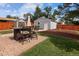 Inviting backyard with a patio, outdoor seating, and lush green lawn, perfect for entertaining and relaxation at 1290 S Elizabeth St, Denver, CO 80210