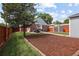 Charming brick home with a spacious backyard, patio, and storage shed, perfect for outdoor entertaining at 1290 S Elizabeth St, Denver, CO 80210
