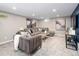 Basement lounge with plush seating, decorative art, and recessed lighting for relaxed living at 1290 S Elizabeth St, Denver, CO 80210