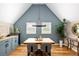 Charming dining room with wood floors, accent wall, and custom wine storage at 1290 S Elizabeth St, Denver, CO 80210