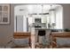 Bright, modern kitchen with white cabinets, stainless steel appliances, and an island with seating at 1290 S Elizabeth St, Denver, CO 80210